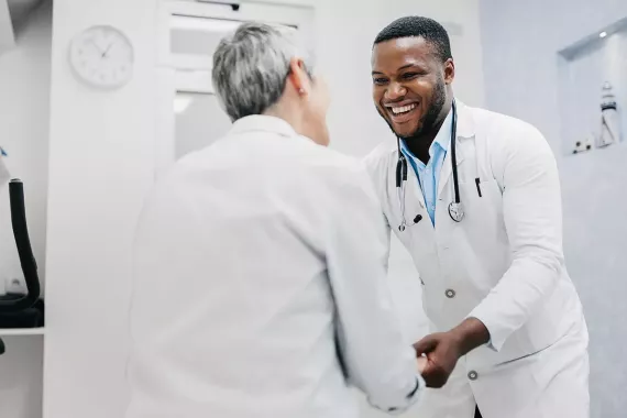 HCP and Patient smiling in medical office